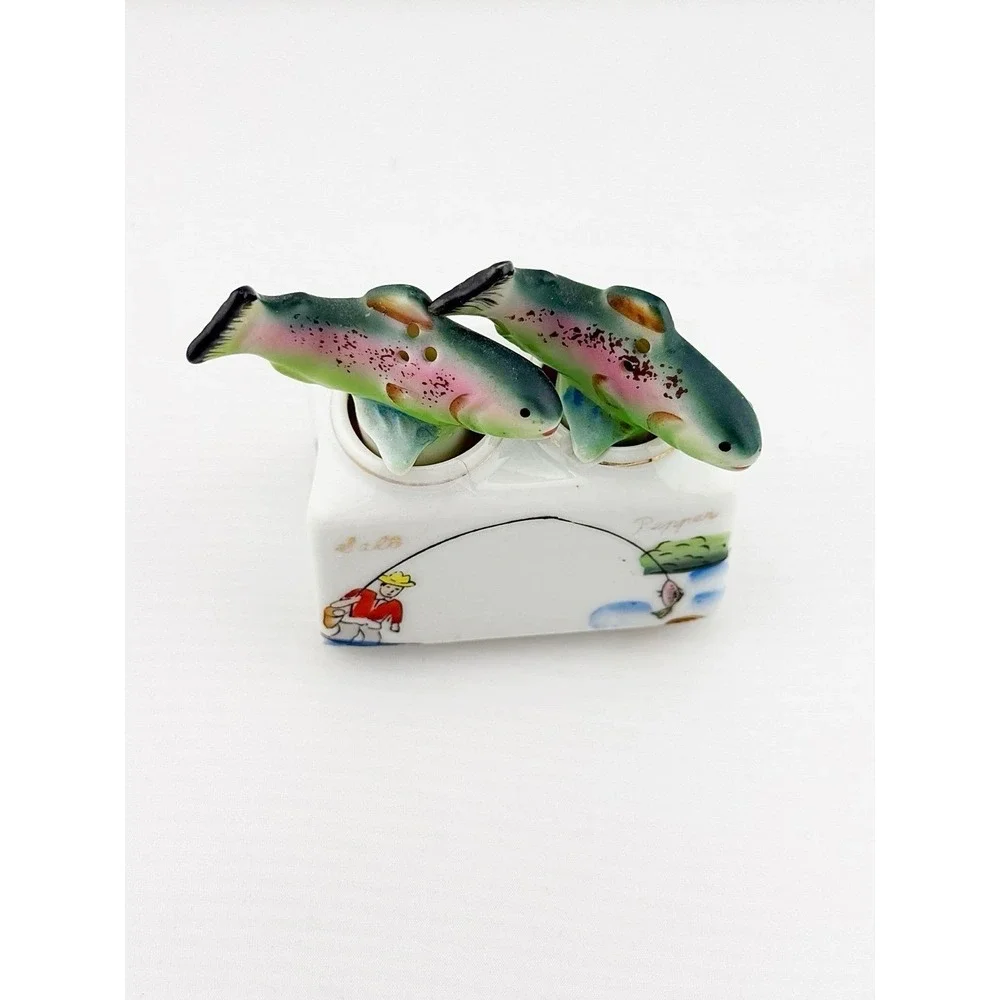 Vintage Japanese 1950's fish nodder salt & pepper shakers. Base shows fishing